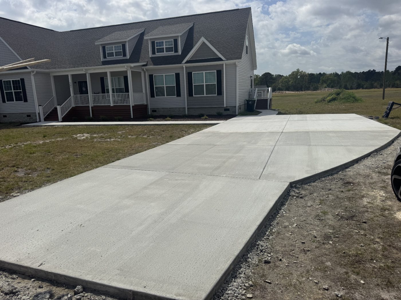 Freshly poured concrete driveway in front of a Wilson County home